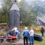 Volunteers get the Eclipse Lookout 100 HP boiler fired. This boiler powered all of the steam engines.