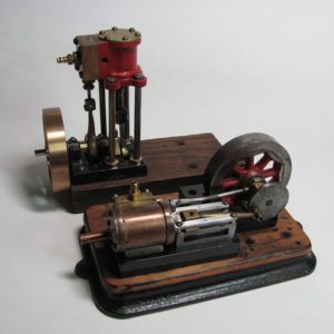 Photo 10. Restored vertical engine with the bronze flywheel and the horizontal engine.